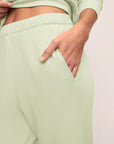 Model is wearing French Terry Jogger in Matcha