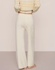Model is wearing Fine Gauge Sweater Pant in Almond Heather