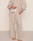 Model is wearing Linen Blend Relaxed Pant in Gingham White/Warm Taupe
