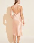 Model wears Inez Washable Silk Slip Dress in Rose Cloud.