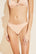 Model wears Pima Stretch Cotton Thong in Buff.