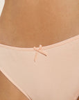 Model wears Pima Stretch Cotton Thong in Buff.