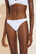 Model wears Pima Stretch Cotton Thong in White.