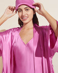Model wears Inez Washable Silk Eye Mask in Italian Rose.