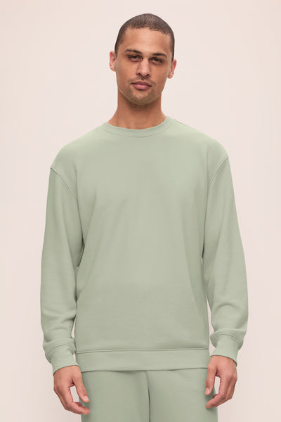 Model is wearing Mens French Terry Sweatshirt in Matcha