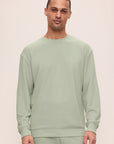 Model is wearing Mens French Terry Sweatshirt in Matcha