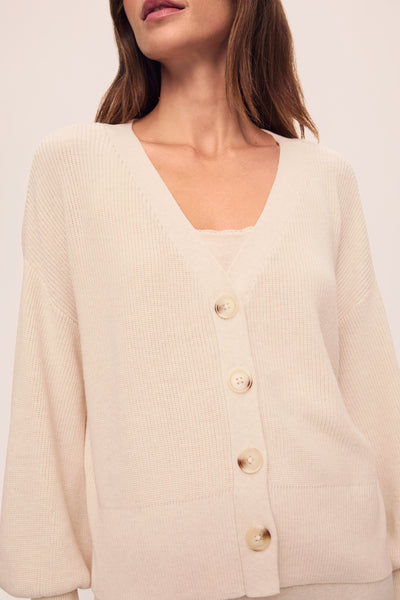 Model is wearing Fine Gauge Sweater Cardigan in  Almond Heather