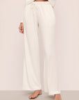 Model is wearing Gisele Tencel™ Modal Everyday Straight Leg Pant in Ivory
