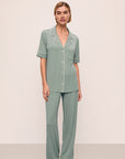 Model is wearing Gisele TENCEL™ Modal Short Sleeve & Pant PJ Set in Eucalyptus/Ivory