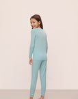 Model is wearing Kids Tencel™ Modal Unisex Long Pj Set in Canal Blue/Ivory