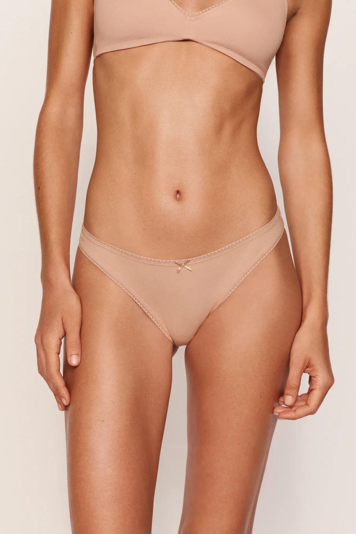 Model is wearing Pima Cotton Thong in Sunkissed