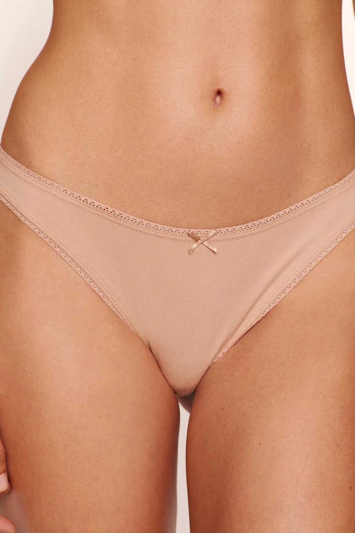 Model is wearing Pima Cotton Thong in Sunkissed