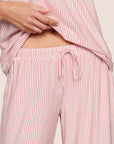 Model is wearing Gisele Printed TENCEL™ Modal Cami & Pant PJ Set  in Duo Stripe Holly Red