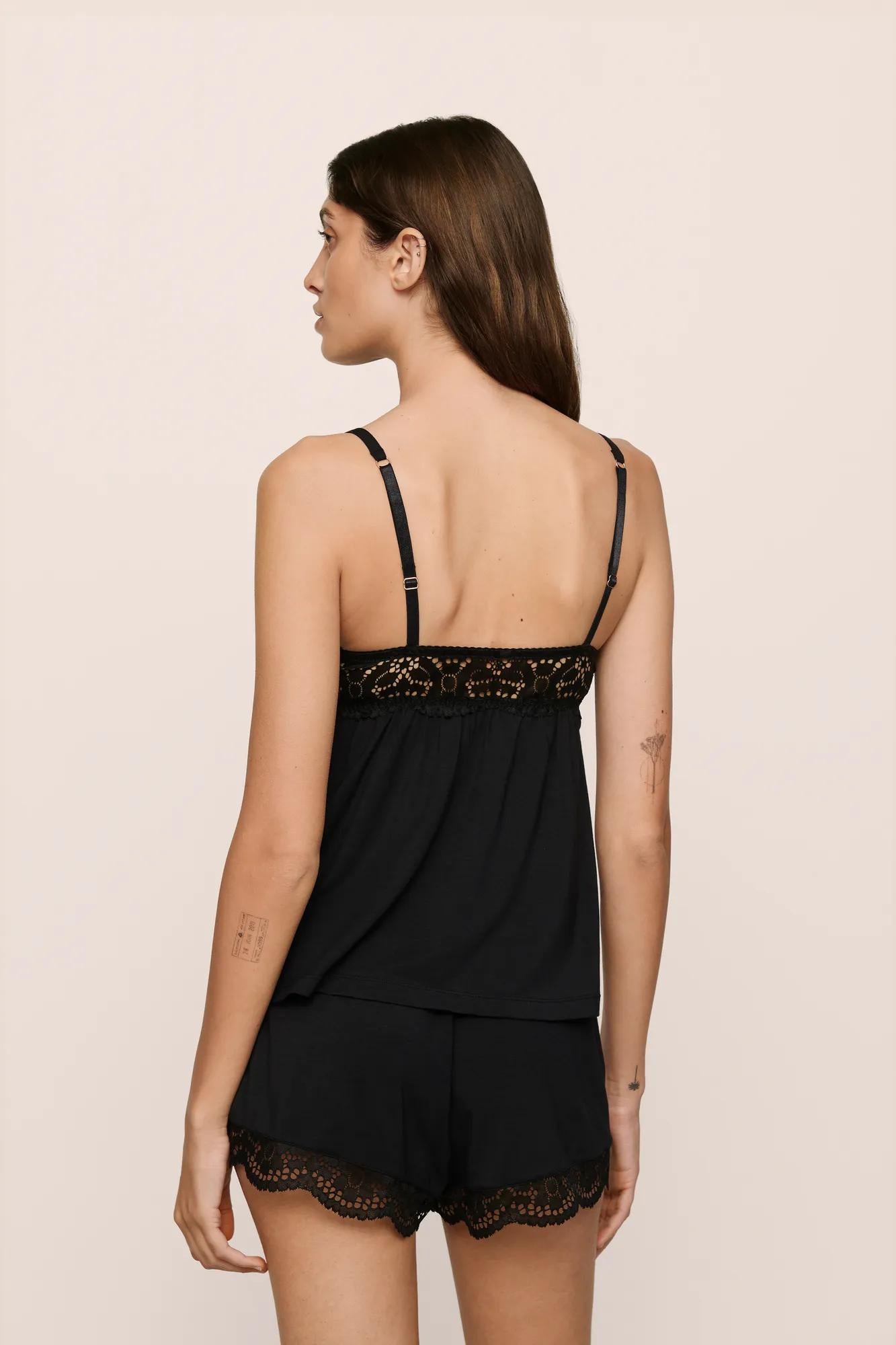 Model is wearing Beatrix TENCEL™ Modal Cami & Short PJ Set in Black