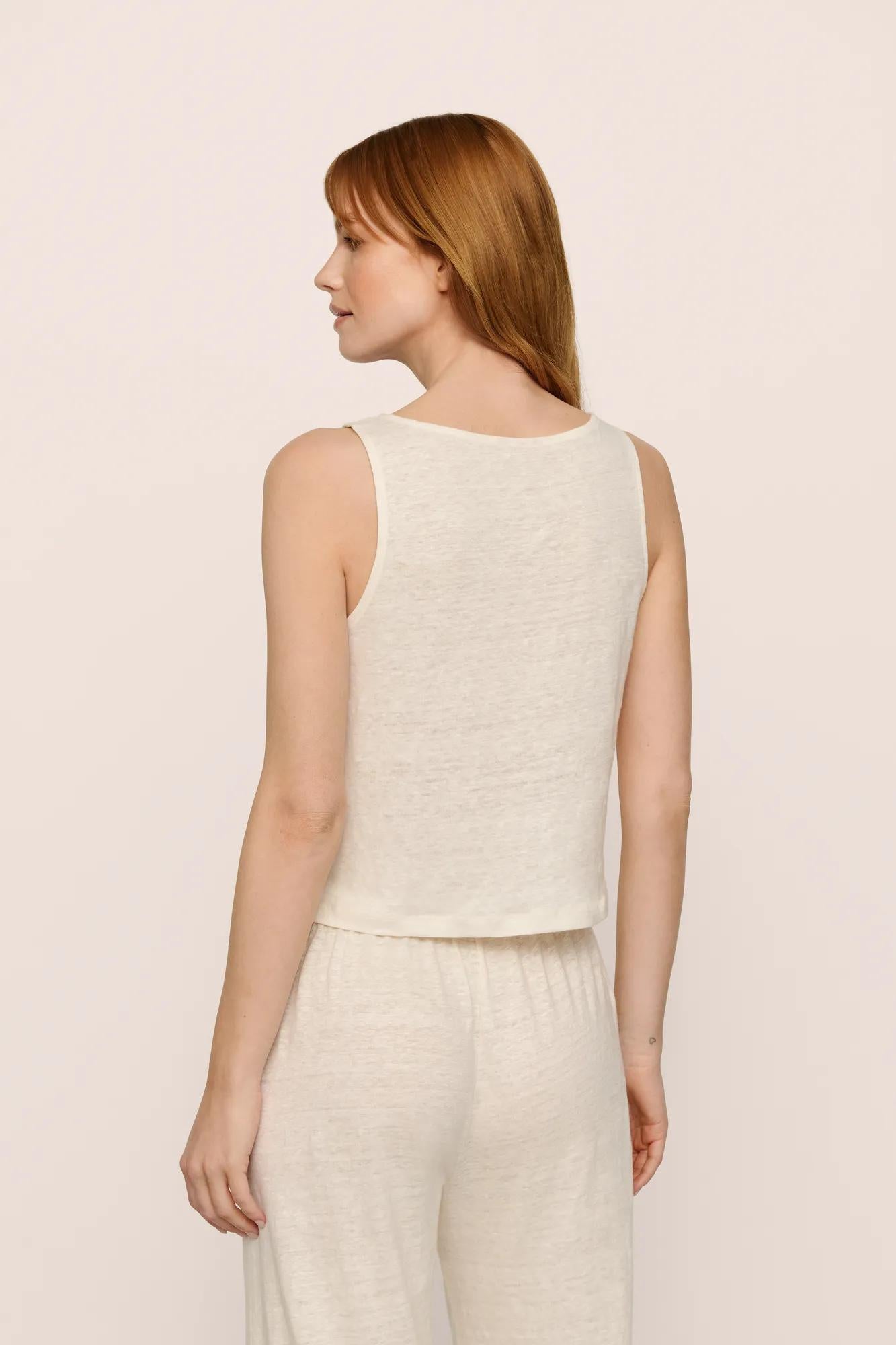Model is wearing Organic Linen Knit Boat Neck Crop Tank in Ivory