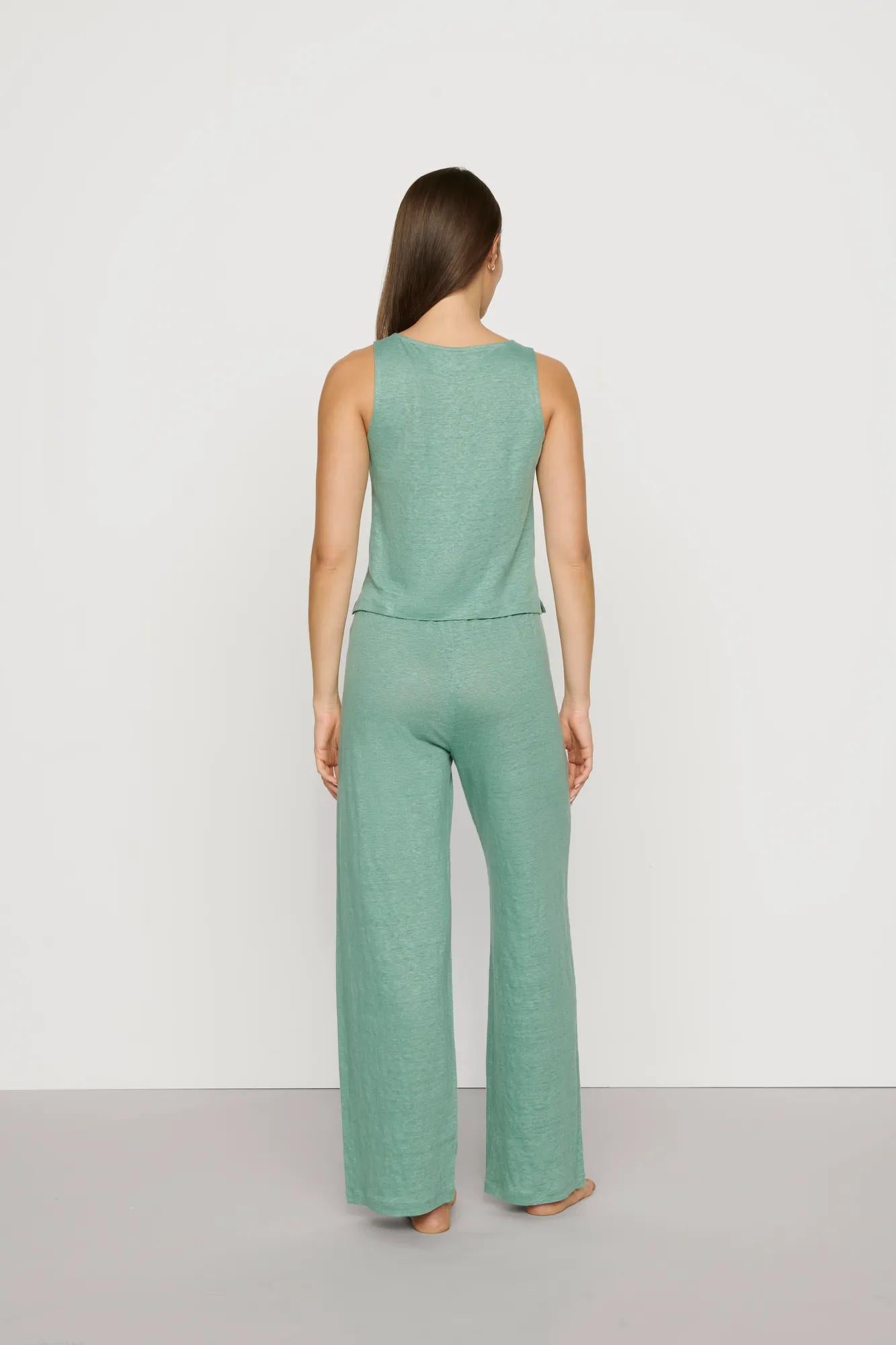 Model is wearing Organic Linen Knit Boat Neck Crop Tank in Seagrass