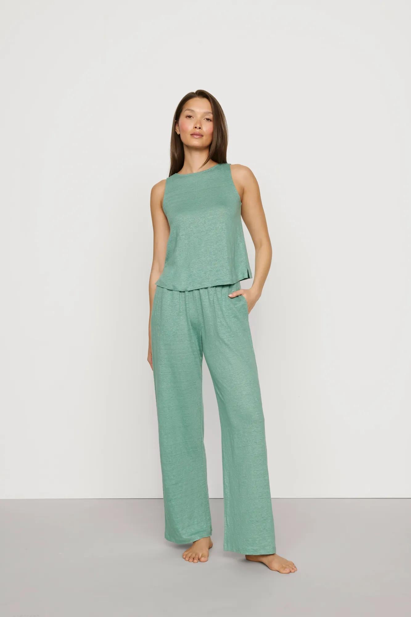 Model is wearing Organic Linen Knit Boat Neck Crop Tank in Seagrass