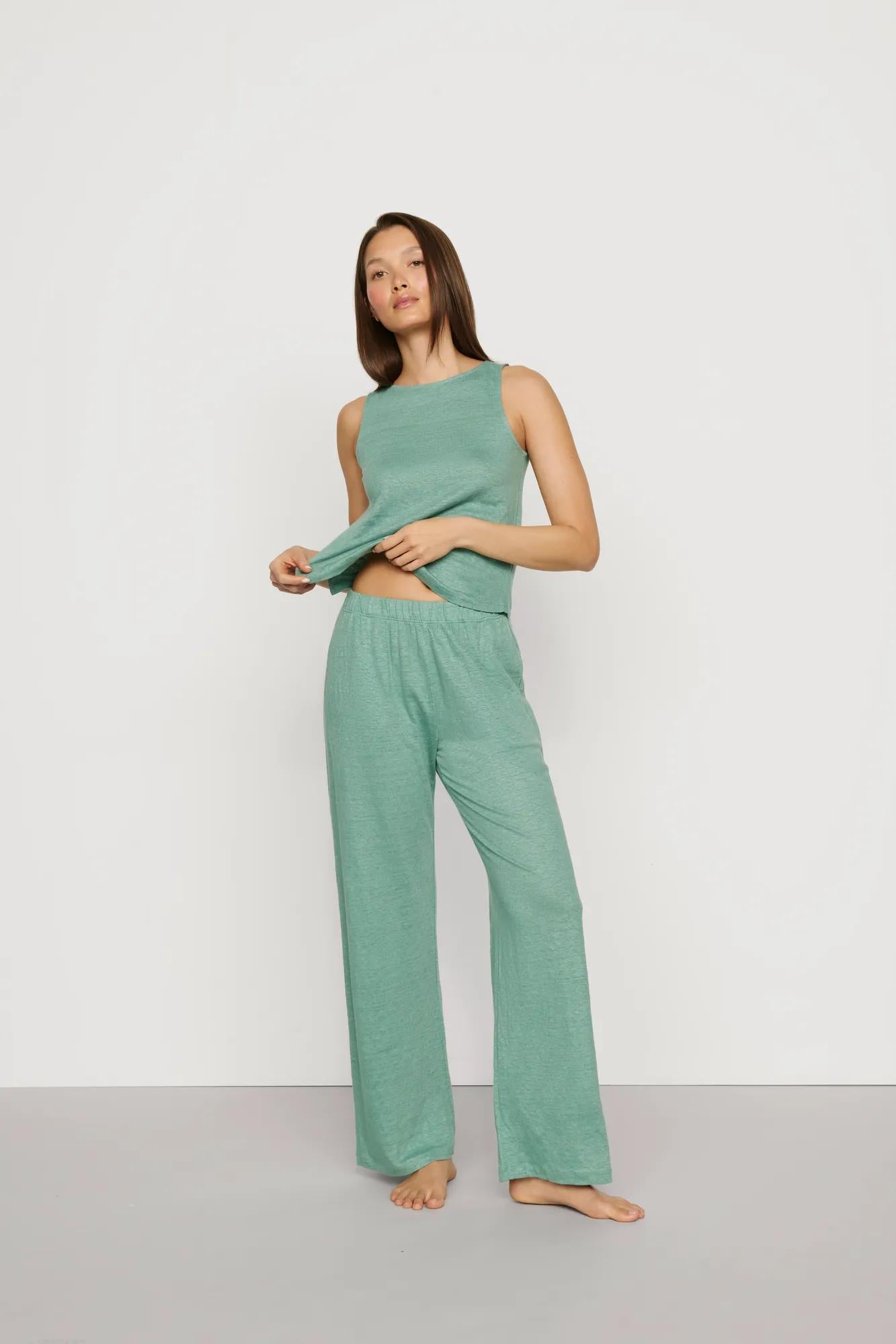 Model is wearing Organic Linen Knit Boat Neck Crop Tank in Seagrass