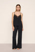 Model is wearing Kari Cami & Pant PJ Set in Black