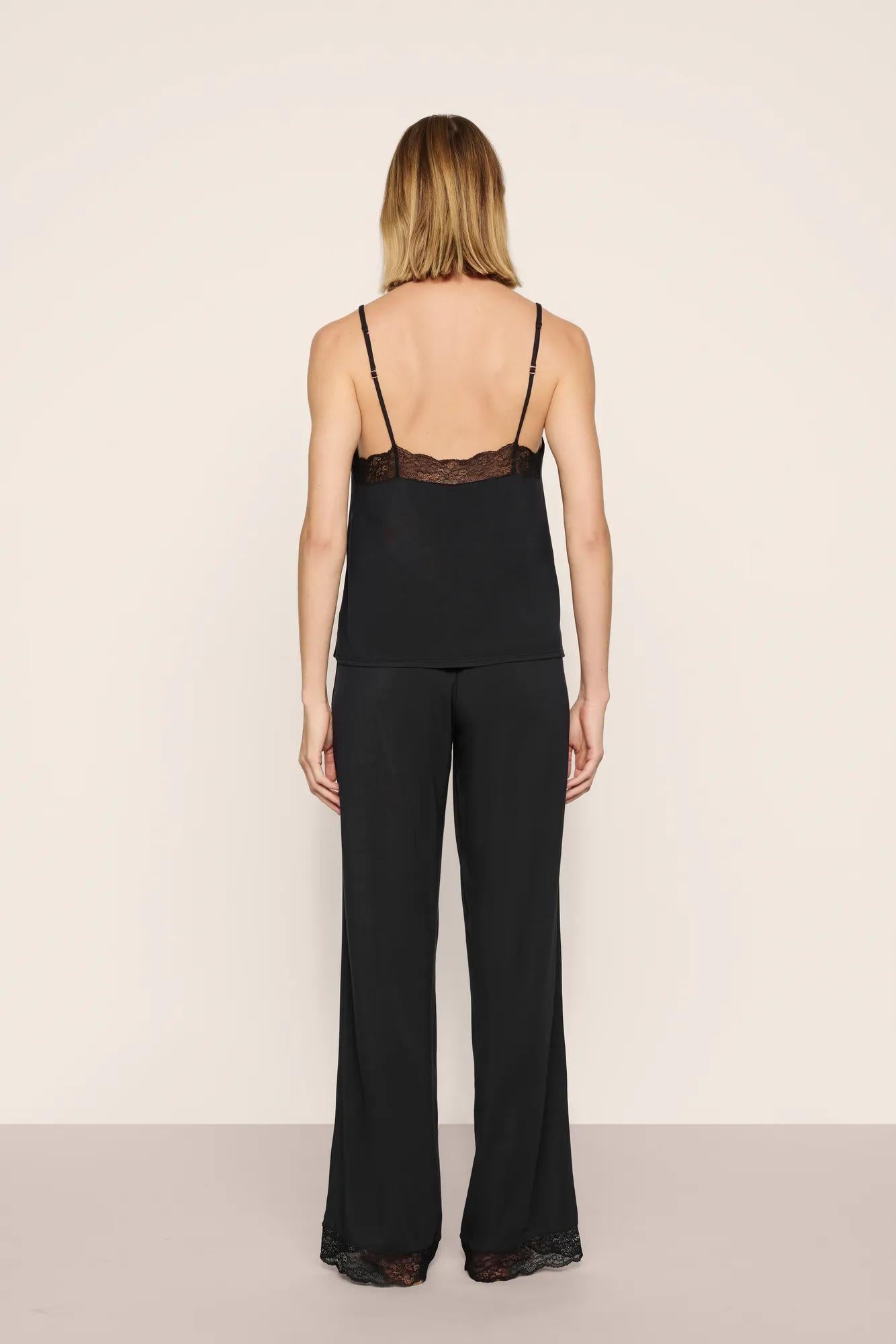 Model is wearing Kari Cami & Pant PJ Set in Black