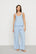 Model is wearing Linen Blend V Neck Cami in Gingham White/Summer Blue