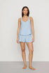 Model is wearing Linen Blend V Neck Cami in Gingham White/Summer Blue