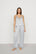 Model is wearing Washable Silk with Lace Embroidery Cami & Pant PJ Set in Powder Blue