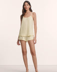 Model is wearing Gisele TENCEL™ Modal Ruffle Cami & Shortie Short Set in Buttercream