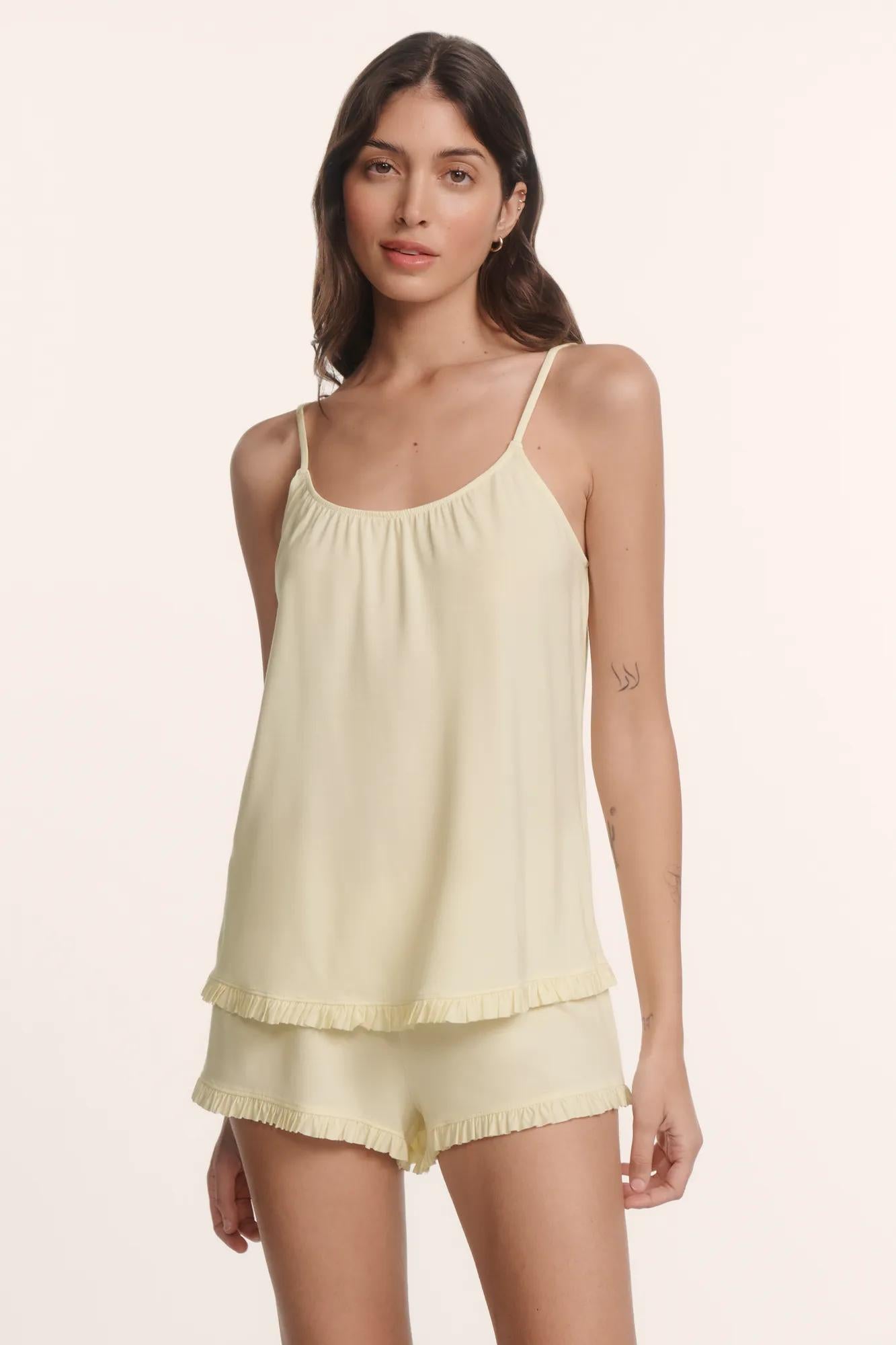 Model is wearing Gisele TENCEL™ Modal Ruffle Cami & Shortie Short Set in Buttercream