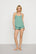 Model is wearing Gisele TENCEL™ Modal Ruffle Cami & Shortie Short Set in Seagrass
