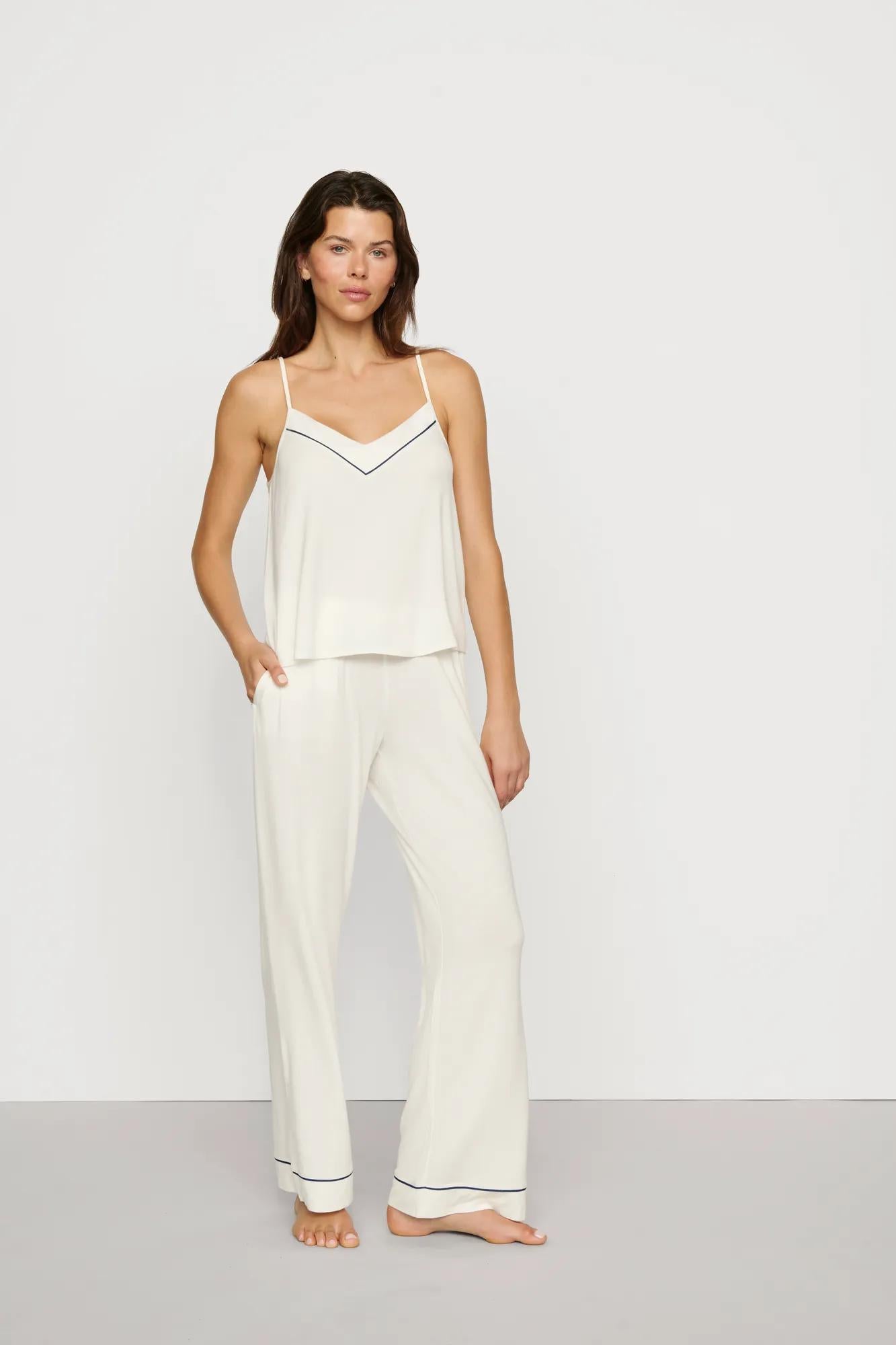 Model is wearing Gisele TENCEL™ Modal V Neck Cami & Pant PJ Set in Ivory/Navy