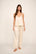 Model is wearing Washable Silk Lace Cami & Pant Set in Champagne