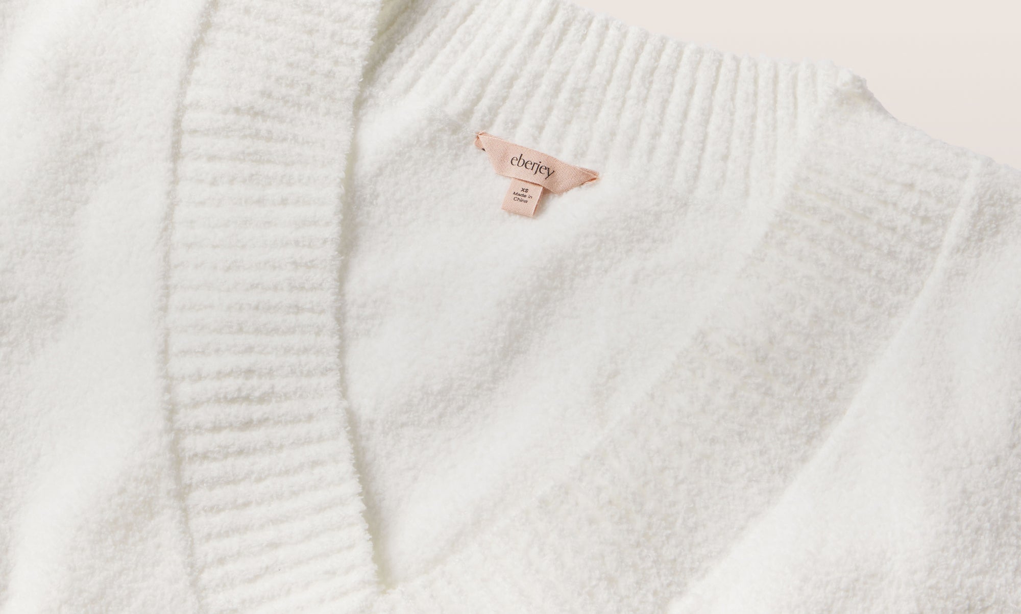 Image of recycled boucle v neck in ivory