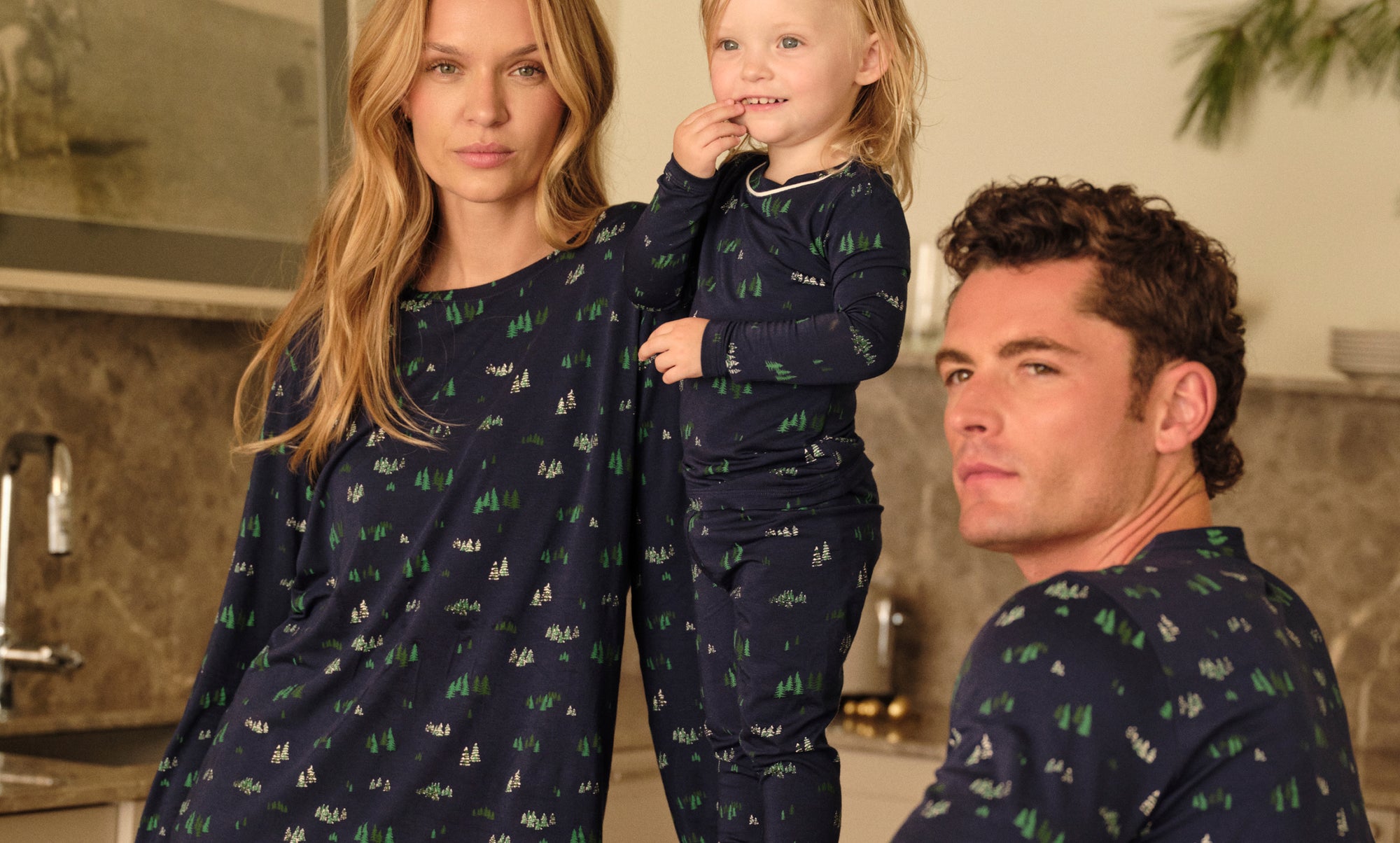 Family in matching PJs in Forest Pine Navy