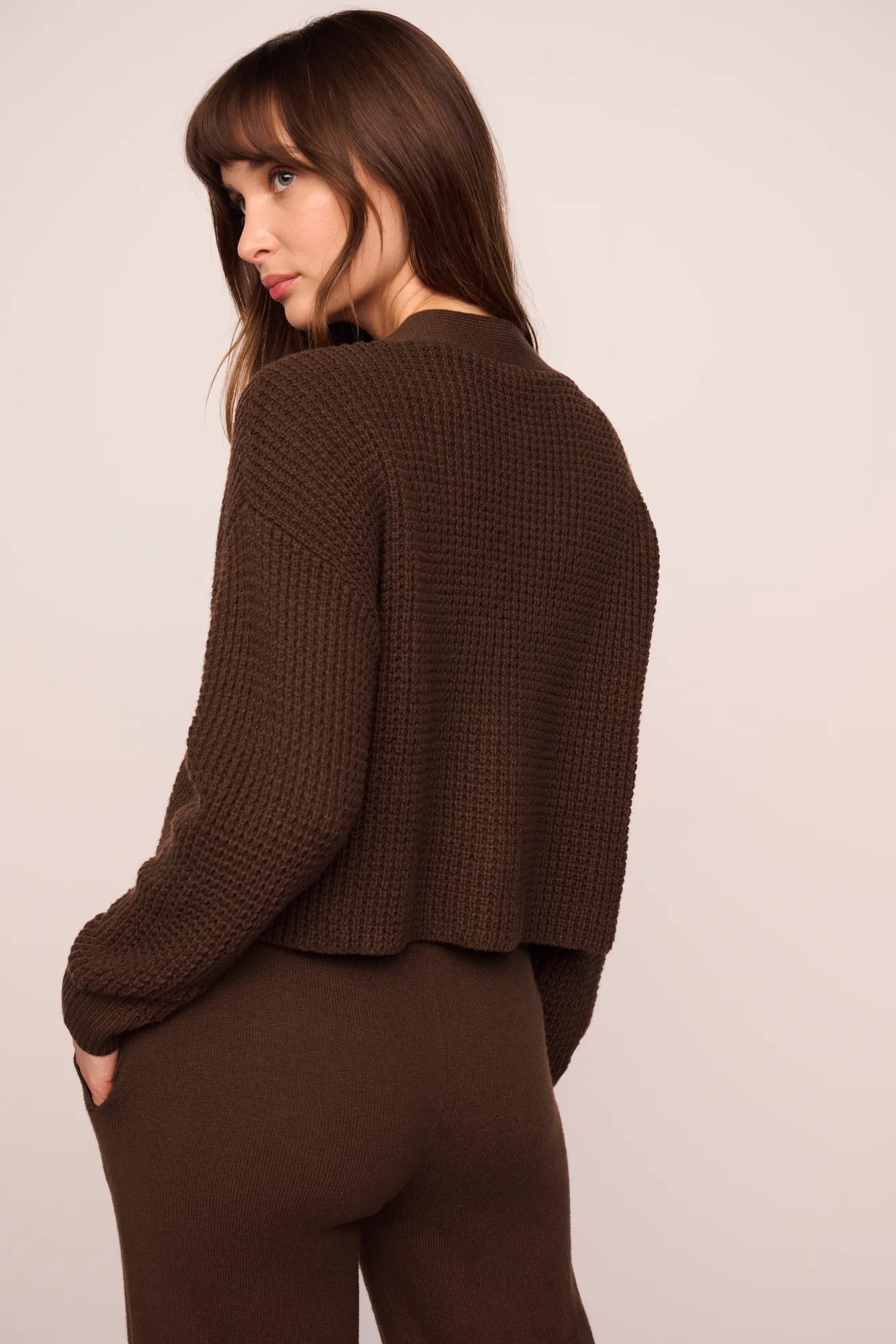 Model is wearing Recycled Sweater Cardigan in  Chocolate
