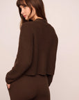 Model is wearing Recycled Sweater Cardigan in  Chocolate