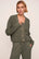 Model is wearing Recycled Sweater Cropped Cardigan  in Smokey Olive