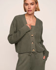 Model is wearing Recycled Sweater Cropped Cardigan  in Smokey Olive
