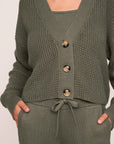 Model is wearing Recycled Sweater Cropped Cardigan  in Smokey Olive