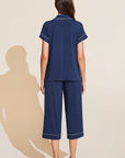 Model wears Gisele TENCEL™ Modal Short Sleeve Cropped PJ Set in navy/ivory.