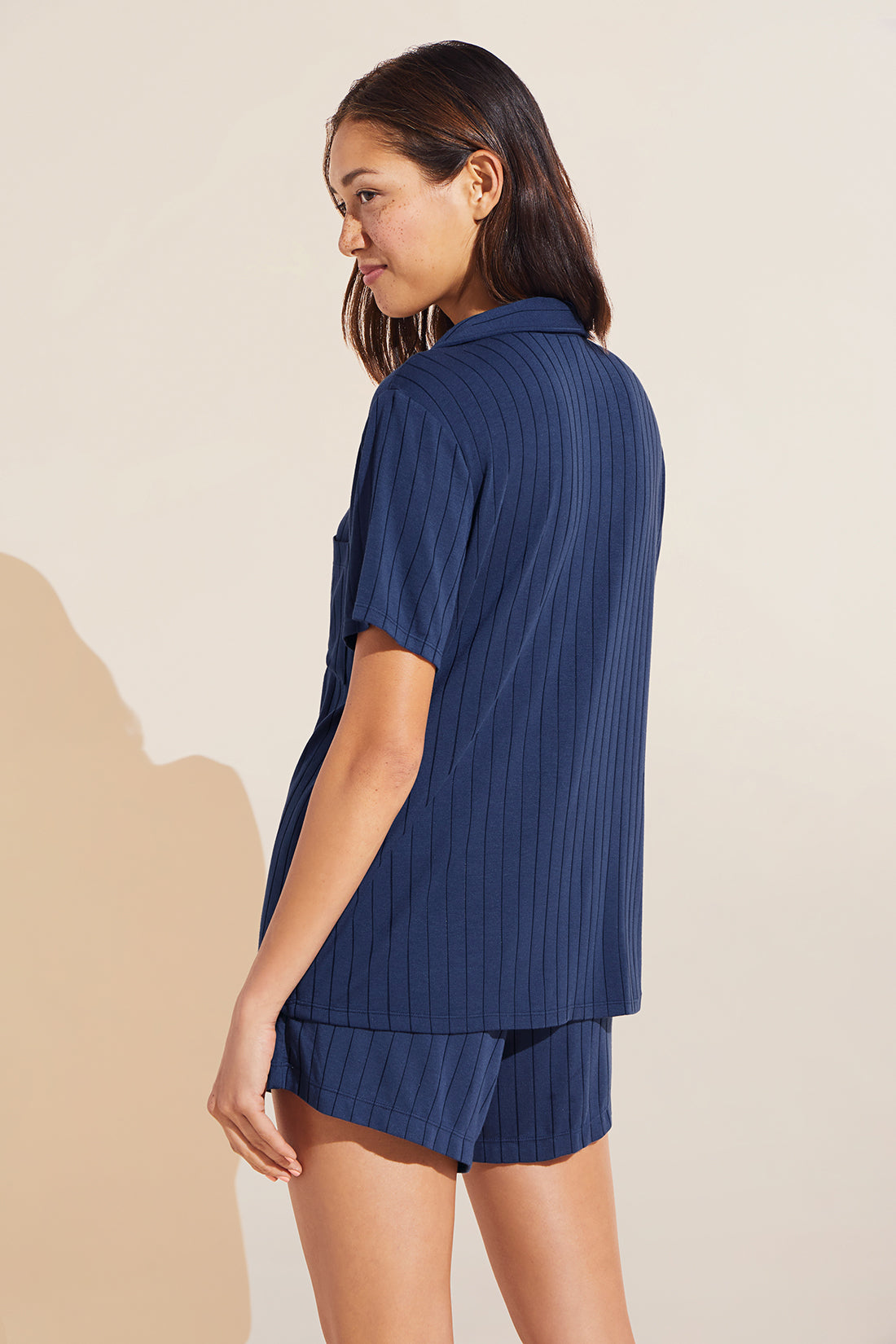 Model wears Gisele TENCEL™ Modal Rib Relaxed Short PJ Set in Navy.