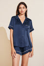 Model wears Inez Washable Silk Short PJ Set in Navy/Champagne.