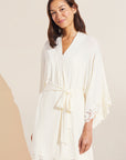 Model wears Naya TENCEL™ Modal Robe in ivory.