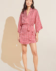 Model wears Inez Printed Washable Silk Short Robe in Leopard Spot Haute Red.