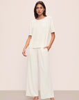 Model is wearing Gisele TENCEL™ Modal Everyday Straight Leg Pant in Ivory