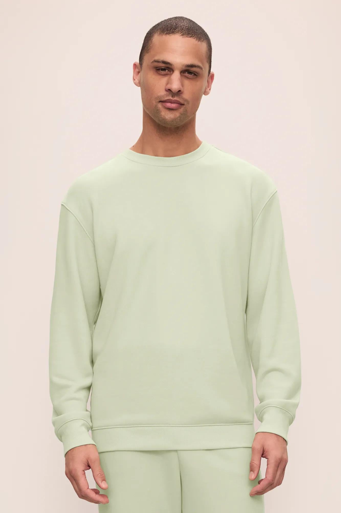 Model is wearing French Terry Sweatshirt in Matcha