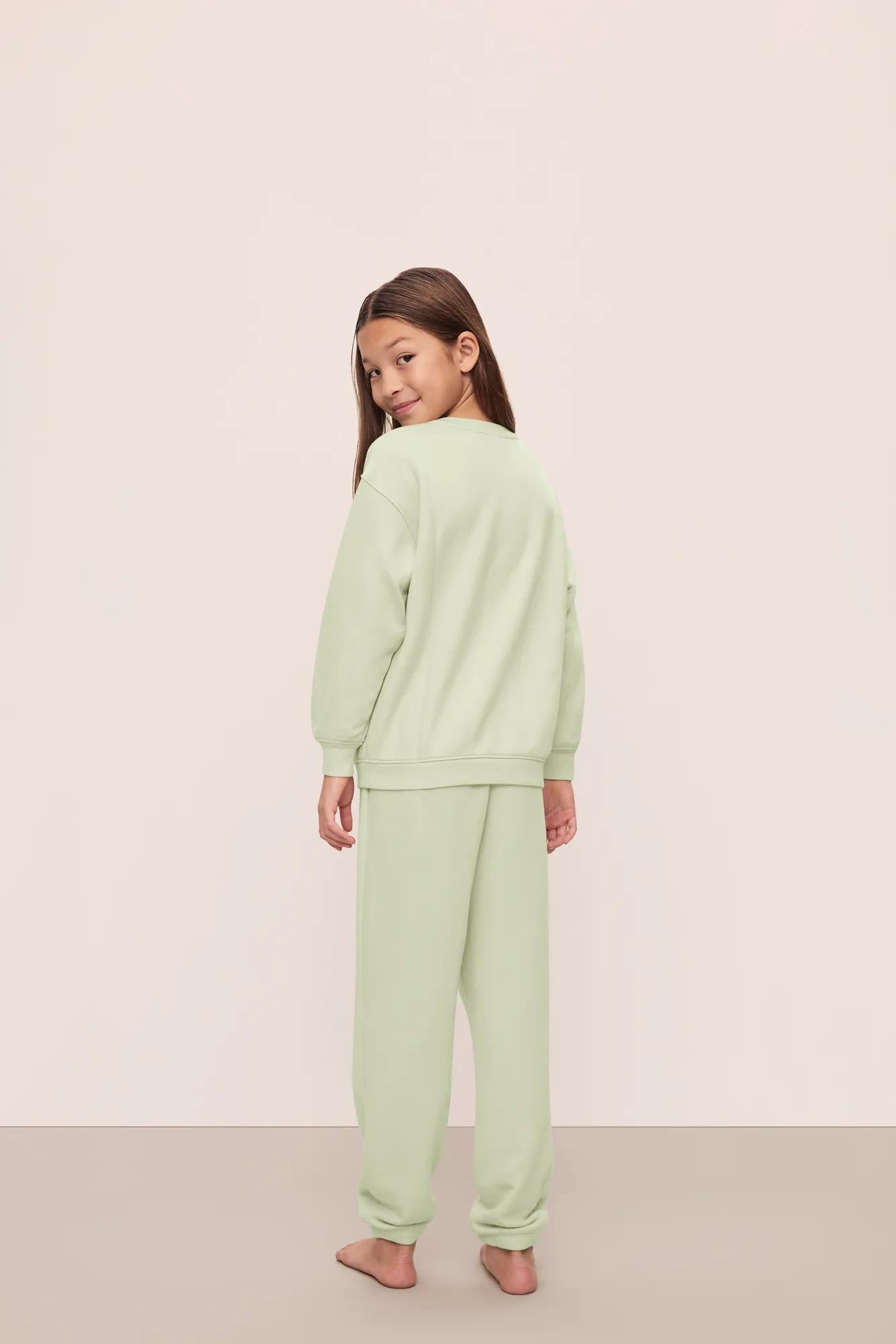 Model is wearing Kid's French Terry Sweatshirt and Jogger Set in  Matcha