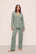 Model is wearing Gisele TENCEL™ Modal Long PJ Set in Eucalyptus/Ivory