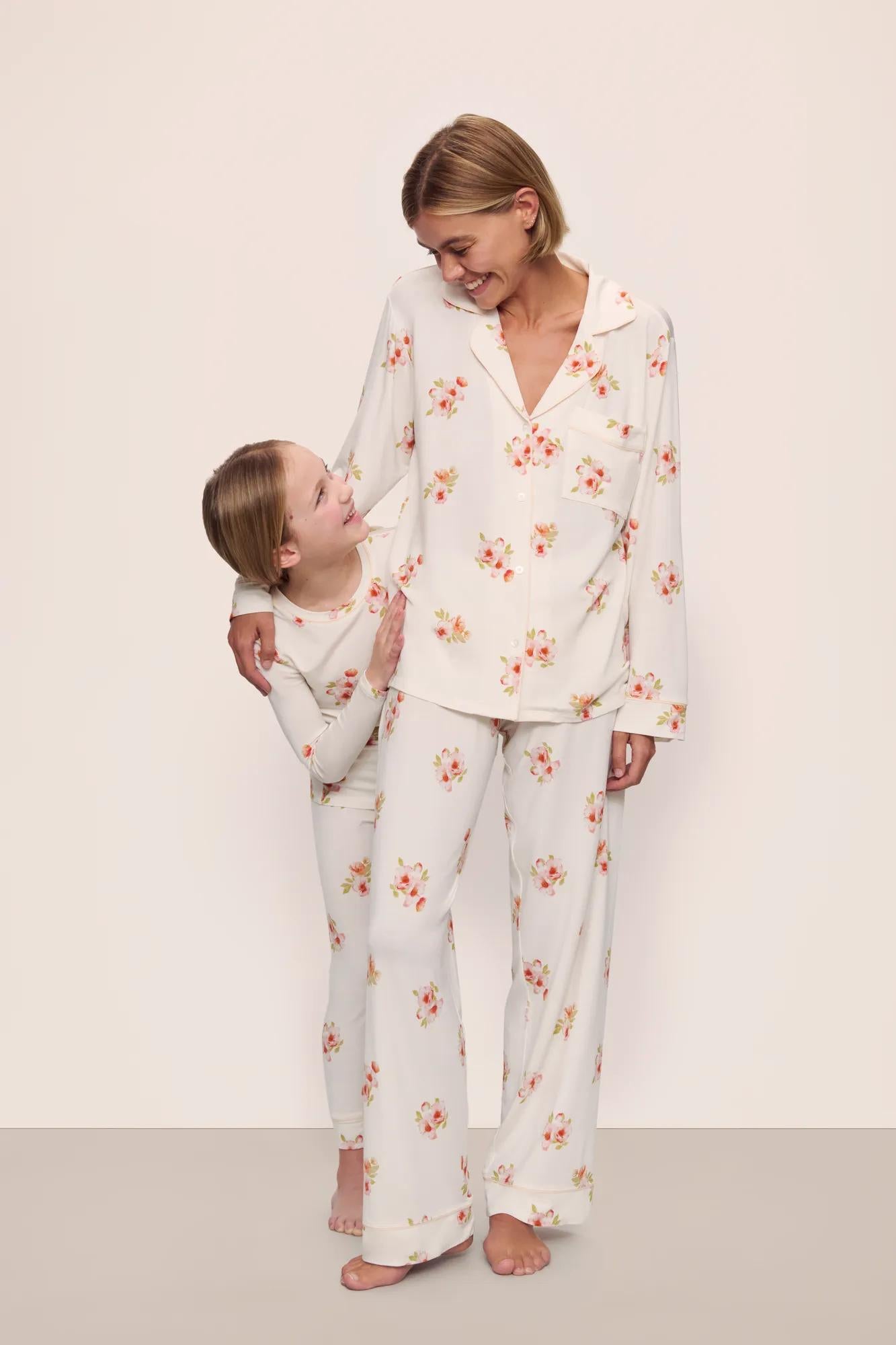 Model is wearing Gisele Printed TENCEL™ Modal Long PJ Set in  Floral Bloom Ivy/Vanilla Cream with kids' model in Kids Printed TENCEL™ Modal Unisex Long PJ Set in  Floral Bloom Ivy/Vanilla Cream