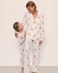 Model is wearing Gisele Printed TENCEL™ Modal Long PJ Set in  Floral Bloom Ivy/Vanilla Cream with kids' model in Kids Printed TENCEL™ Modal Unisex Long PJ Set in  Floral Bloom Ivy/Vanilla Cream